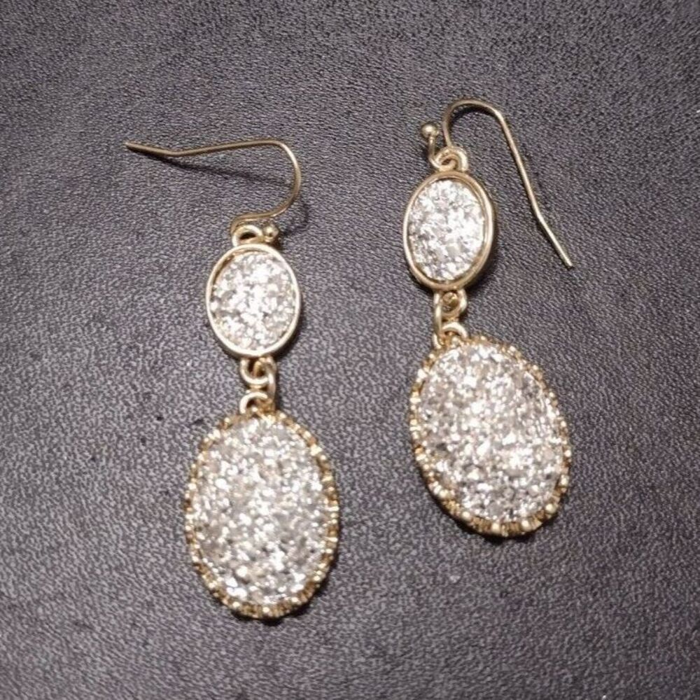 Gold tone earrings with sparkly silver
